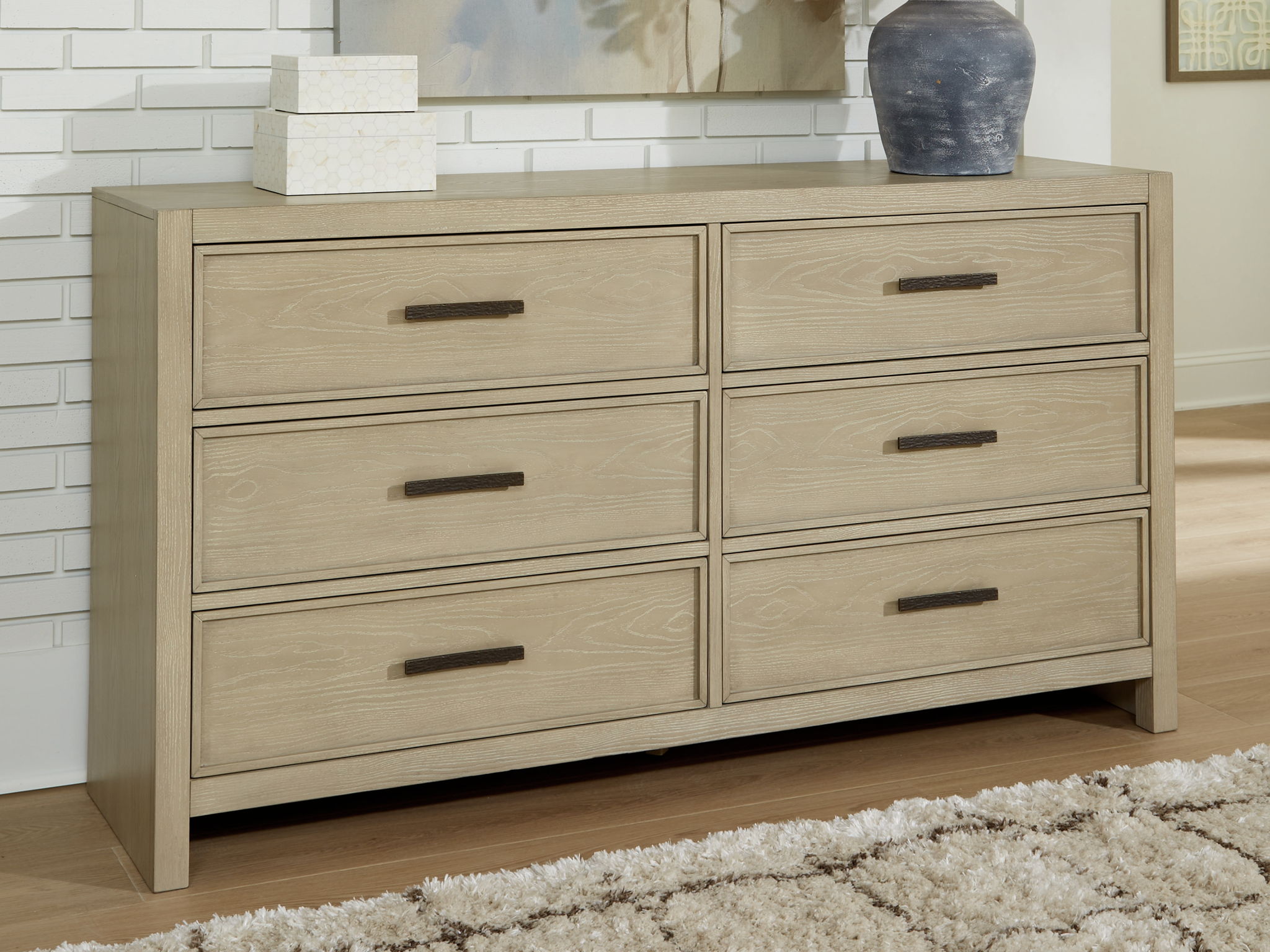 Dresser smooth-gliding storage s are accented with stylish metal bar pulls in a