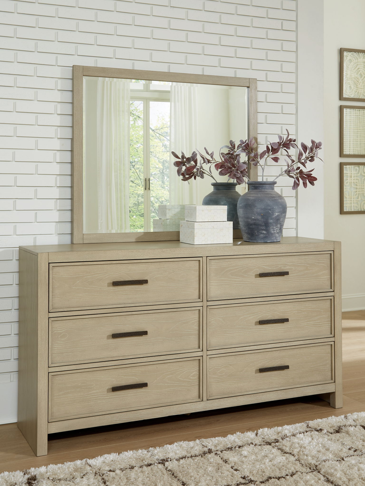 Dresser smooth-gliding storage s are accented with stylish metal bar pulls in a