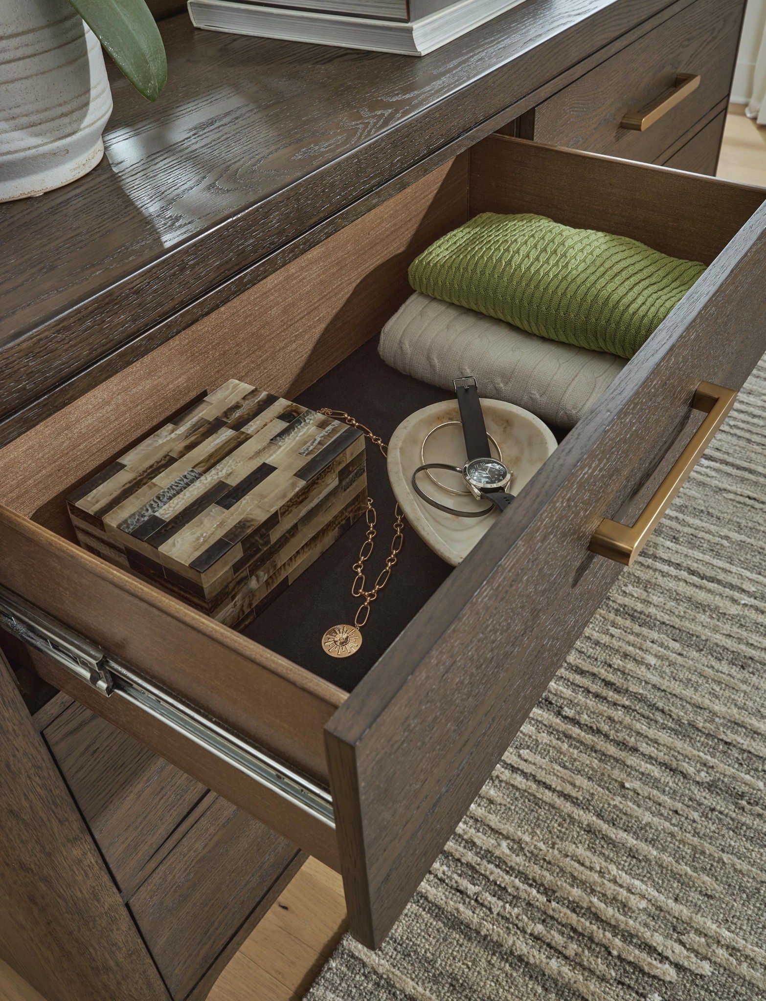 Dresser in a rich wood tone, this dresser is an expertly crafted balance of luxury and