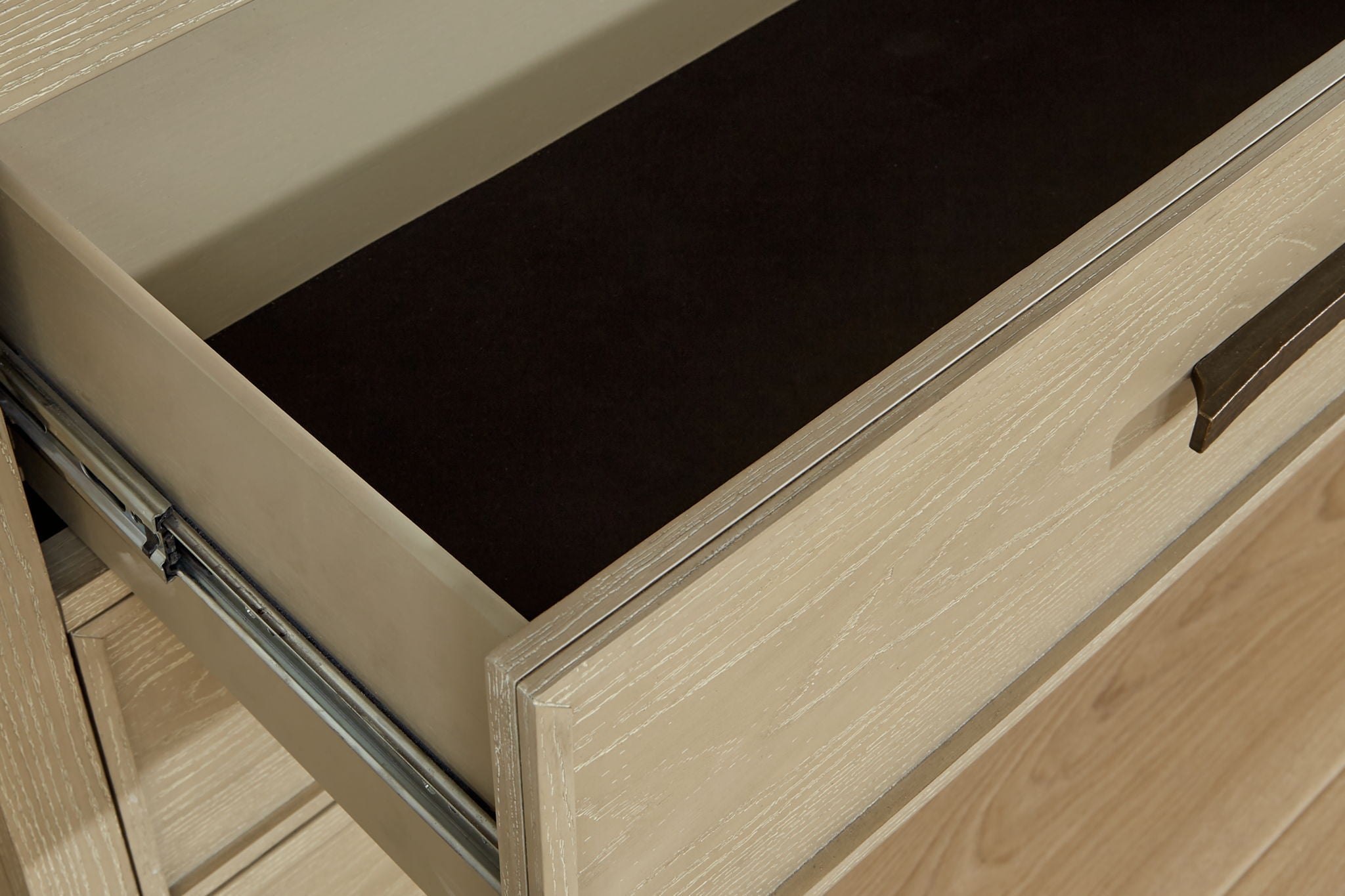 Dresser smooth-gliding storage s are accented with stylish metal bar pulls in a