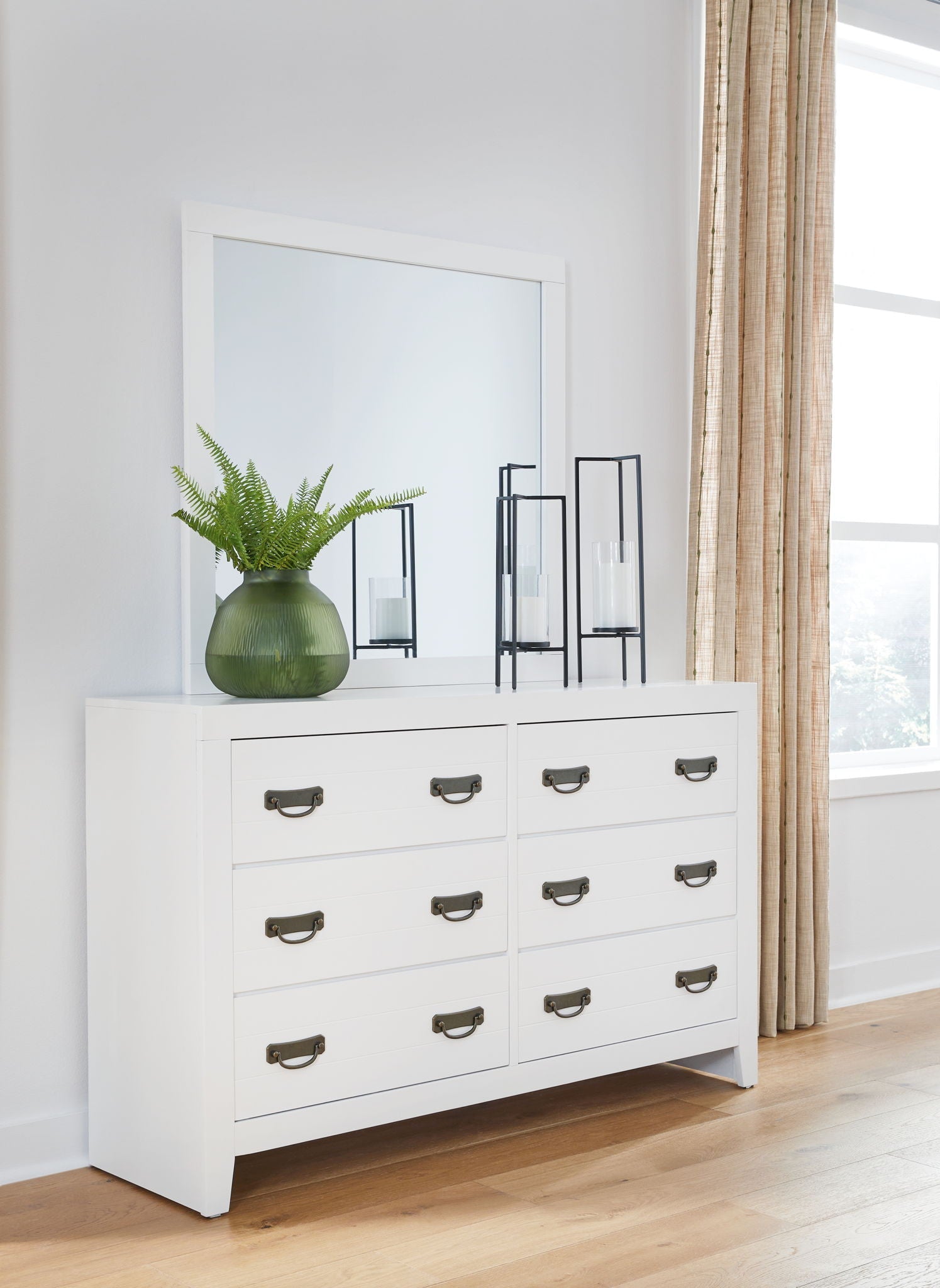 Dresser And White the clean, white finish conveys an easy-breezy sensibility, while spacious s