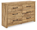 Commode du chic urbain à la ferme moderne, cette pièce polyvalente reflète harmonieusement